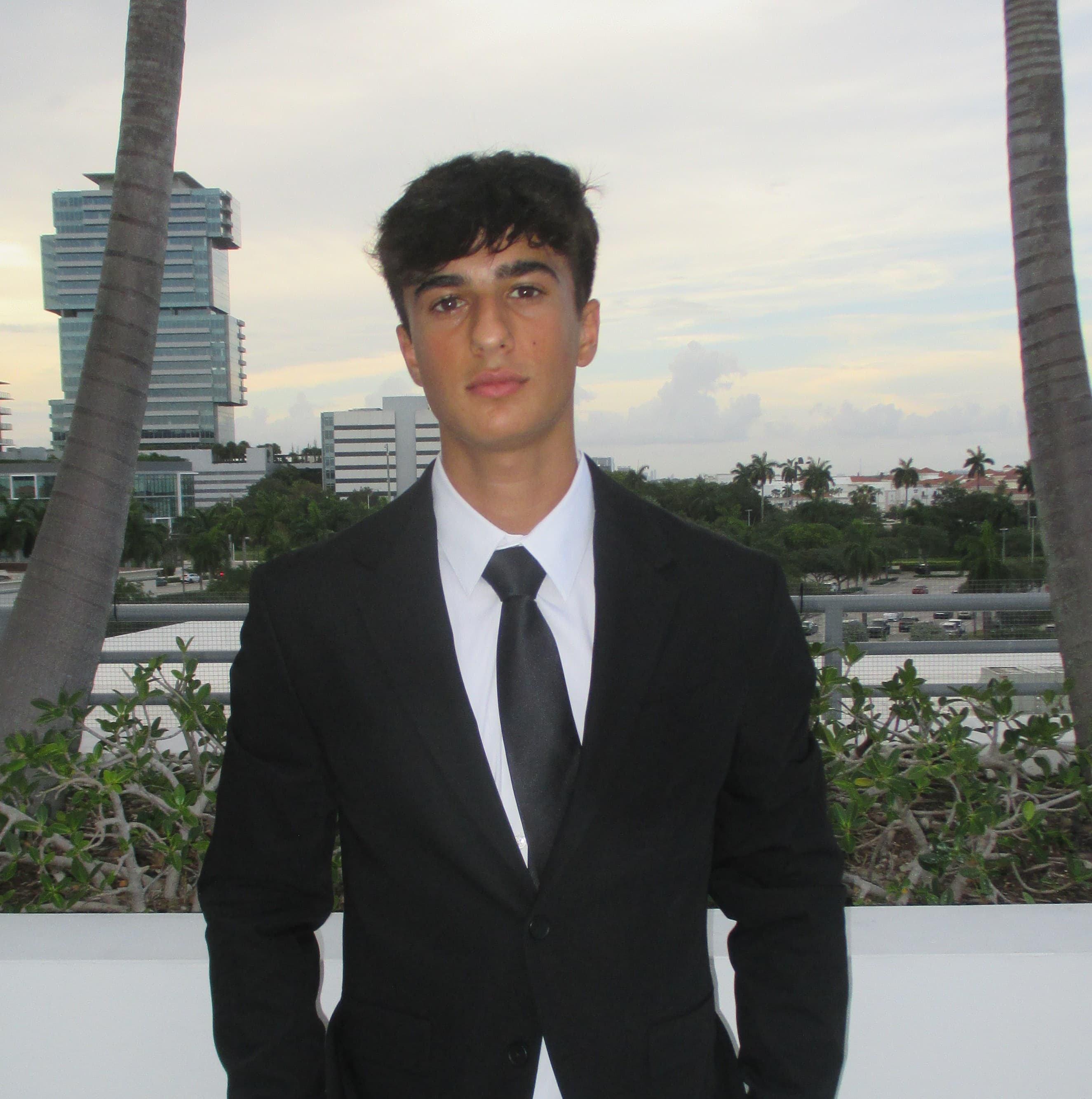 Ori Algave wearing a suit
