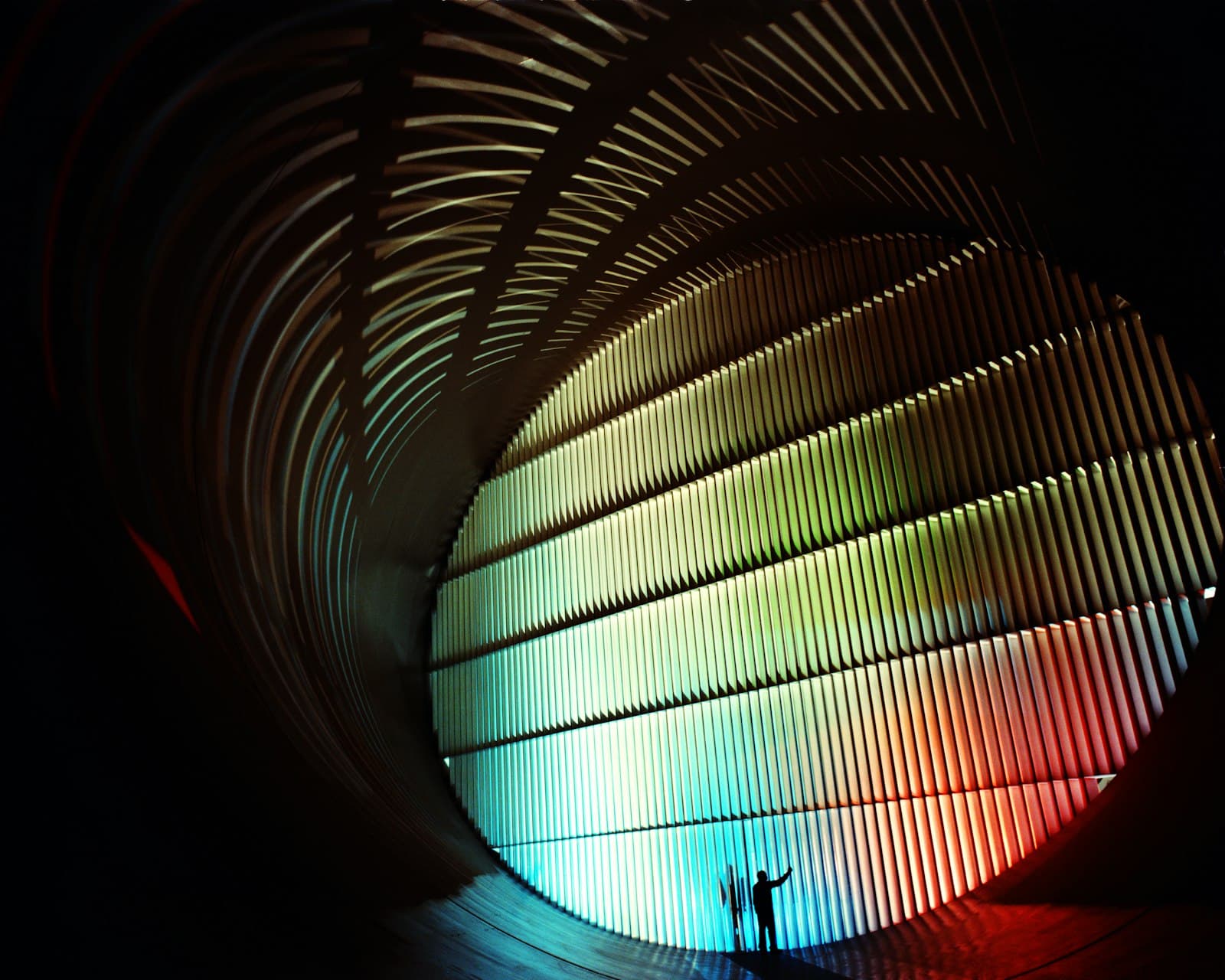 Interior of a full-scale wind tunnel with lit turning vanes